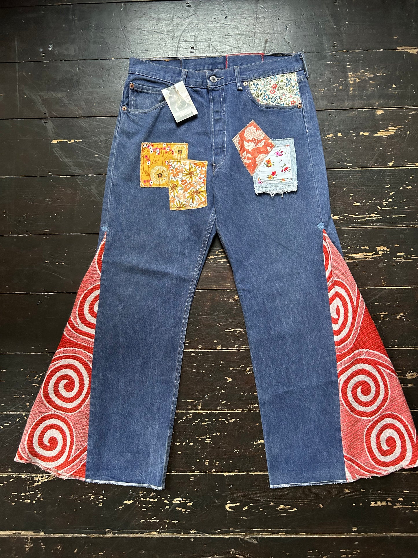ORANGE SWIRL VINTAGE REWORKED LEVI'S 501's JEANS
