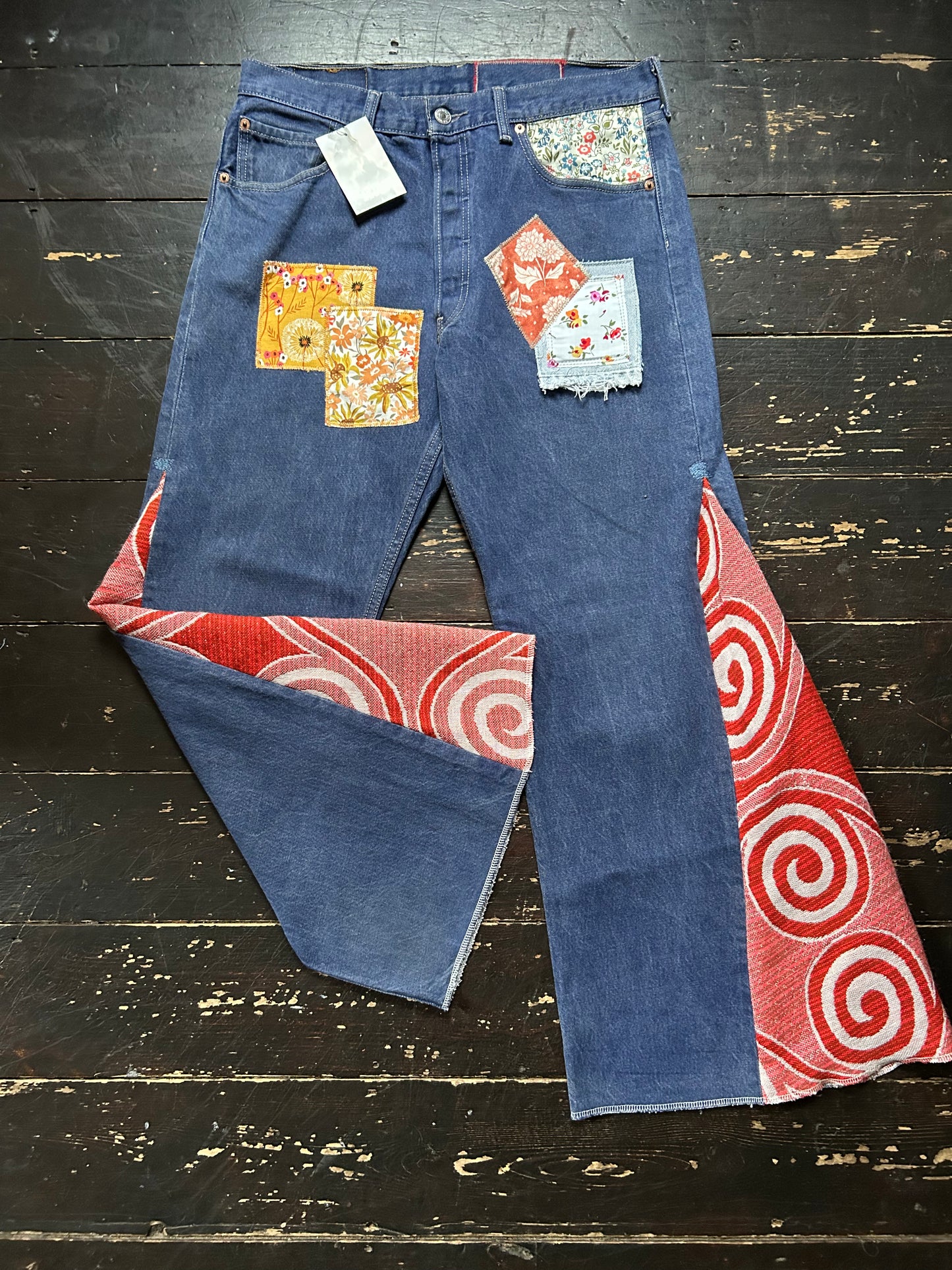 ORANGE SWIRL VINTAGE REWORKED LEVI'S 501's JEANS