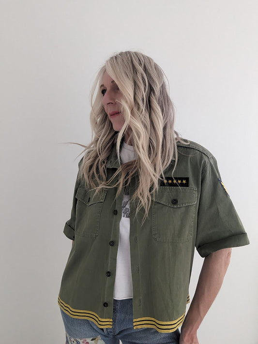 Person wearing a green jacket with a white background